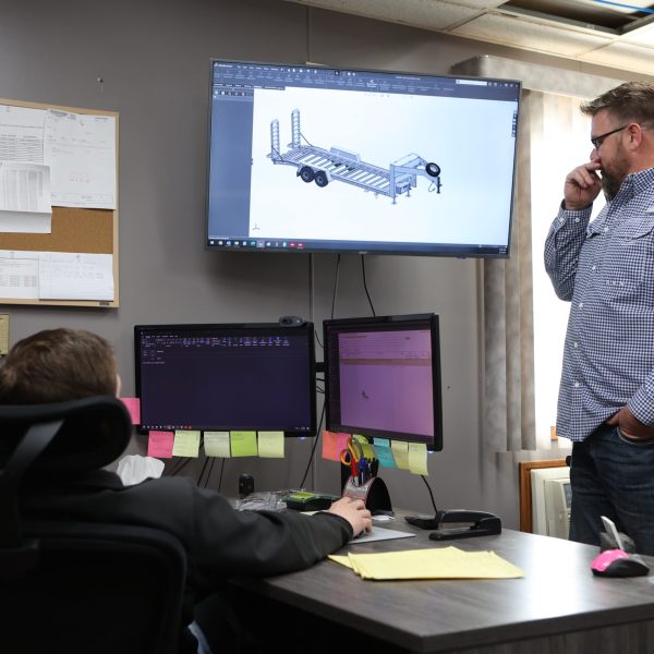 Image of engineers working on a trailer design for Towmaster.